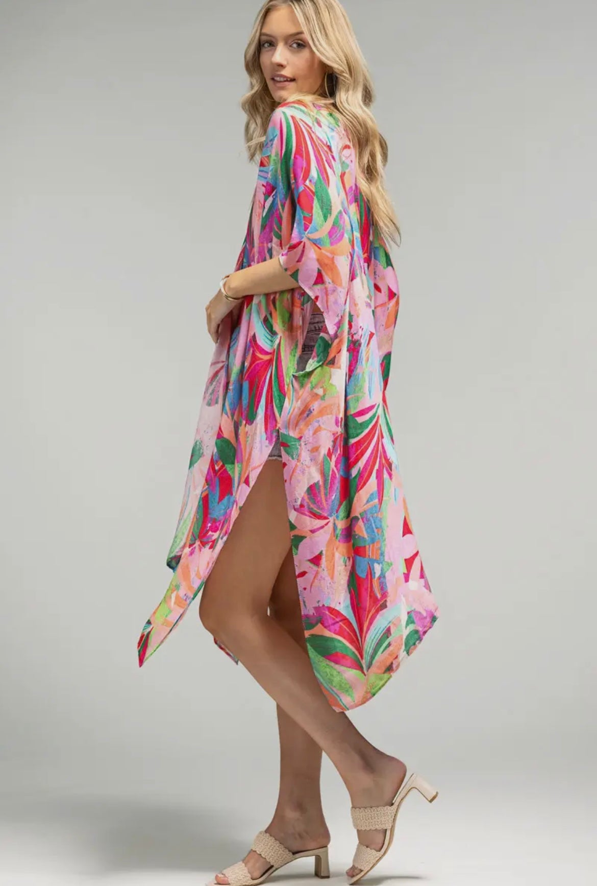 Side angle of colourful Lexi Kimono – lightweight flowy kimono with pink tropical design