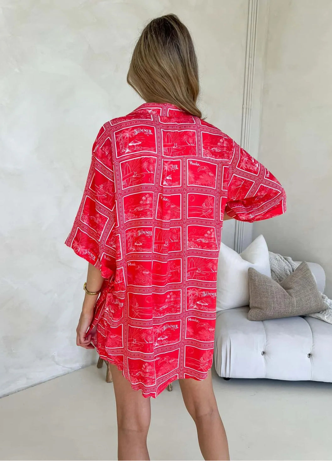Back view Model wearing Monroe Avenue Summer Set – matching red printed shirt and shorts with white drawstring waist and bold tropical holiday print