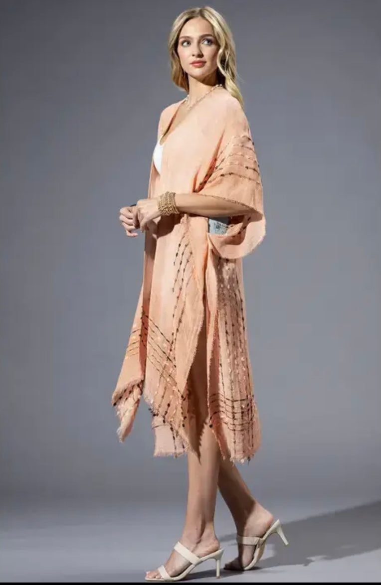 Side view of Coral Kimono styled with white tank and denim shorts