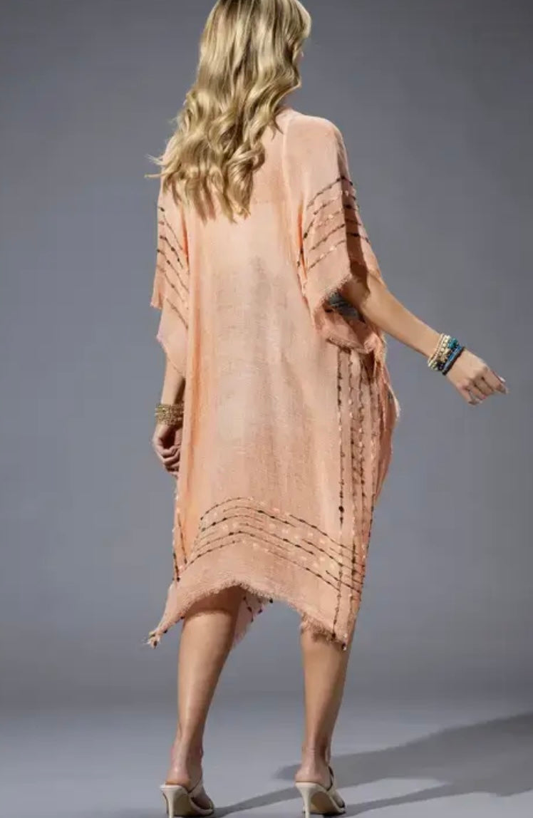 Back view of Coral Kimono with peach hue and striped woven detail