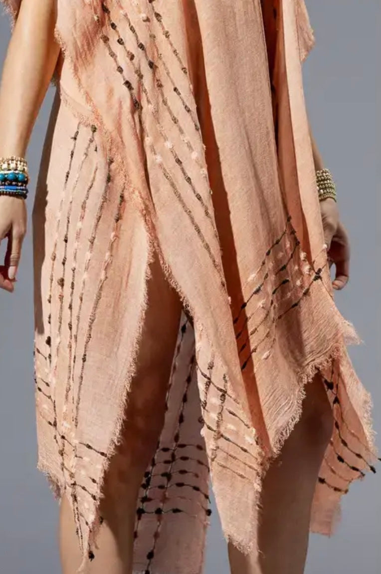 Close-up of Coral Kimono fringe hem and soft texture