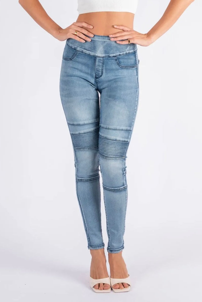 A pair of high-waisted skinny jeans with ribbed moto paneling on the thighs and knees, in a light wash with subtle fading.
