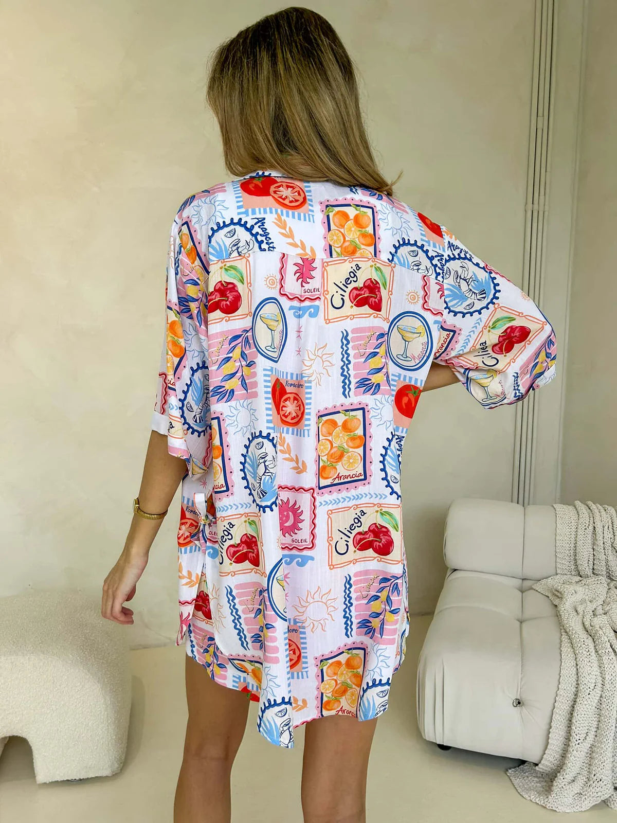 Back of women's short sleeve button-up shirt with holiday fruit postcard print - matching set from Monroe Avenue