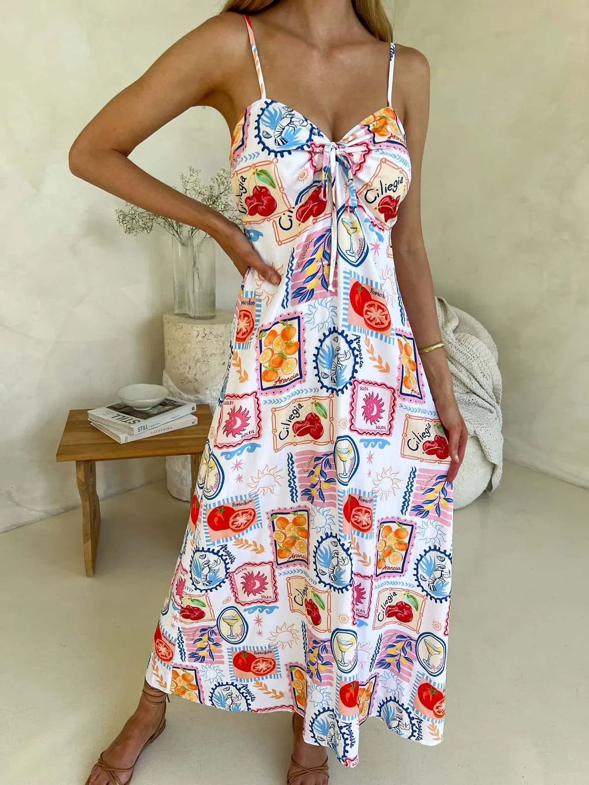 Cameo Dress – women’s colorful printed midi dress with spaghetti straps and tie-front bust, fully lined and perfect for summer outfits.